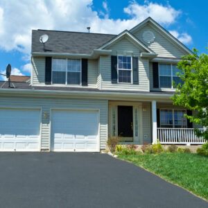 Single family house in suburban Maryland, United States.  Two car garage, driveway and basketball hoop.